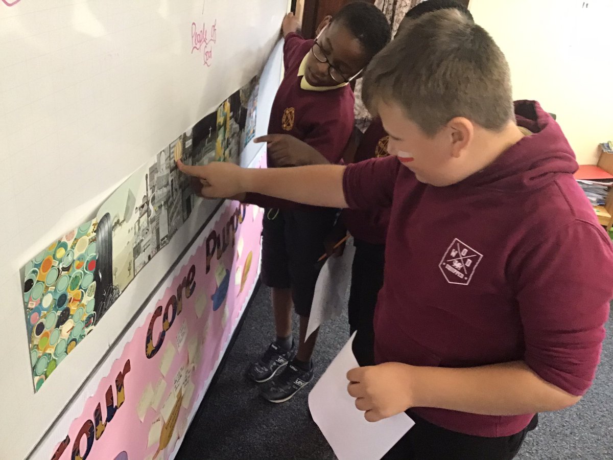 Children  looking at a poster in a classroom