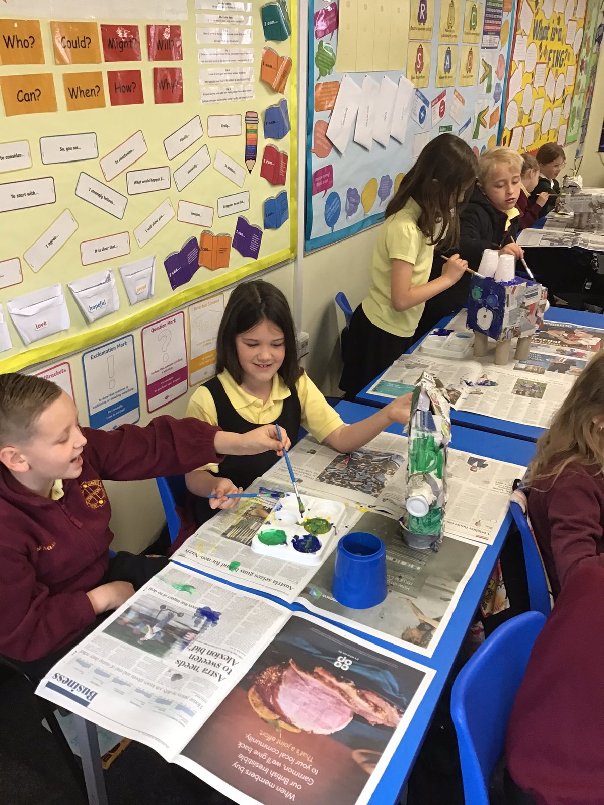 Children painting in a classroom